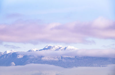 Blurry mountain view with snow on top and beautiful colurful sky , vancouver canada