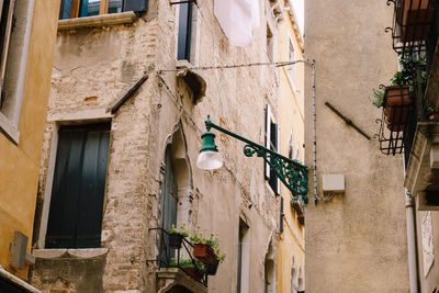 Low angle view of clothes drying outside building