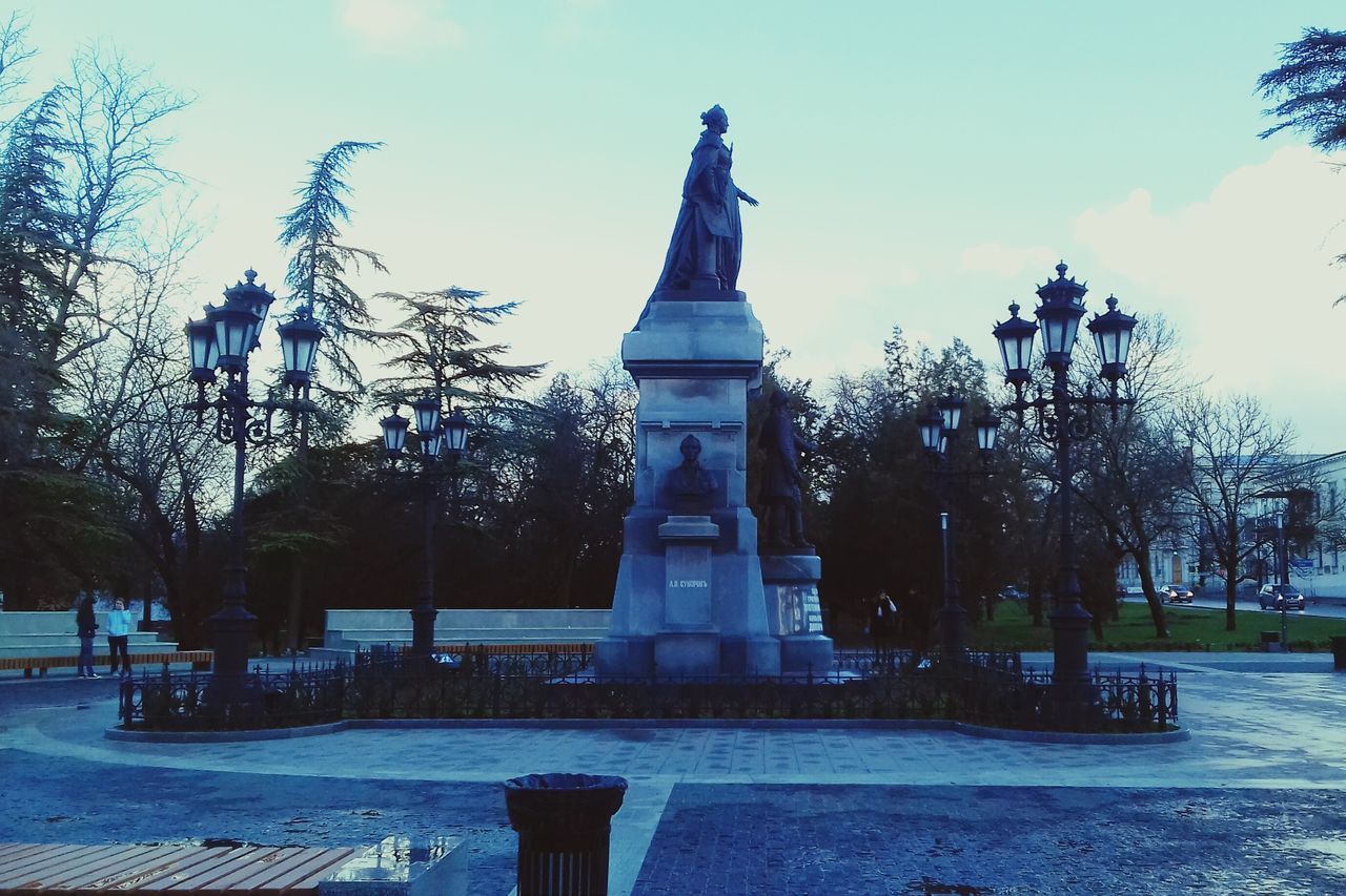 tree, sky, travel destinations, built structure, outdoors, no people, architecture, fountain, statue, sculpture, day