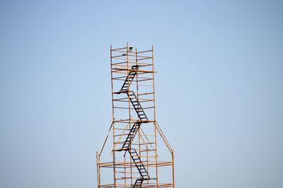 Low angle view of built structure against clear blue sky