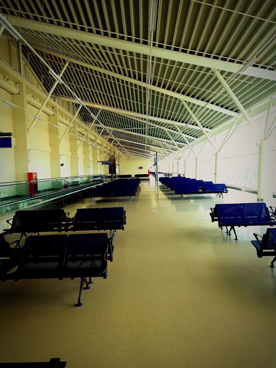 indoors, transportation, architecture, ceiling, hangar, built structure, mode of transportation, transport, airport, aviation, no people, airport departure area, travel, airplane, seat, air vehicle