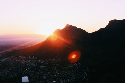 Sun shining over mountains