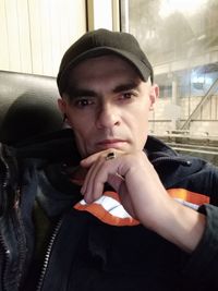 Portrait of young man smoking cigarette