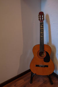 Guitar on parquet floor at home