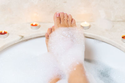 Low section of woman in bathroom at home