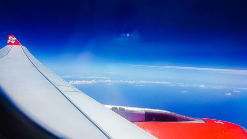 Cropped image of airplane against sky