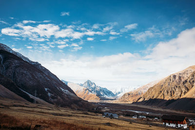 Scenic view of snowcapped mountains against sky