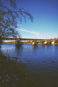 Bridge over river against sky