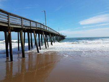 Pier over sea against sky