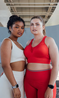 Portrait of young woman standing in gym