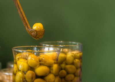 Close-up of yellow glass on table