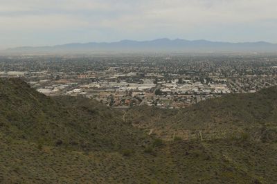 Aerial view of cityscape against sky