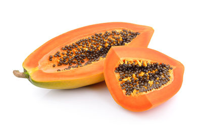 Close-up of orange slice against white background