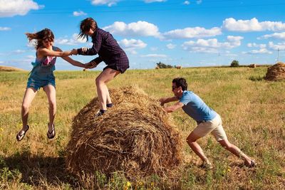 Full length of children on landscape against sky