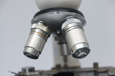 Low angle view of electric lamp against white background