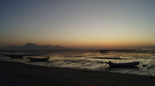 Scenic view of sea against clear sky during sunset