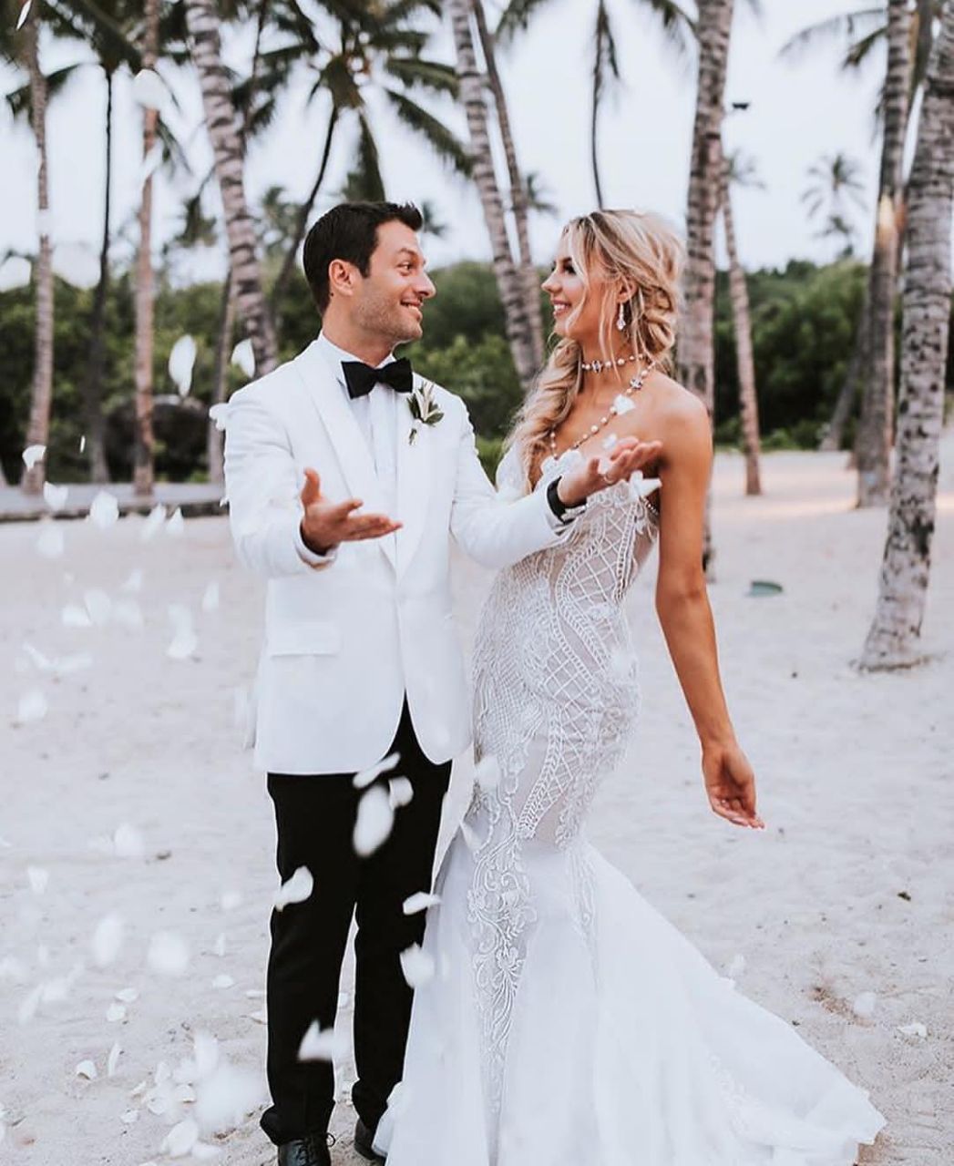 celebration, adult, event, wedding dress, two people, wedding, women, newlywed, love, bride, emotion, men, bridal clothing, married, positive emotion, togetherness, happiness, gown, clothing, young adult, ceremony, life events, female, romance, smiling, white, nature, formal wear, fashion, dress, standing, tradition, day, tree, outdoors, full length, plant, marriage, holding hands, bonding, cheerful, elegance, wedding ceremony, person, honeymoon, land