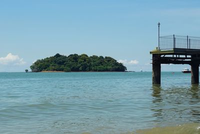 Scenic view of sea against clear blue sky