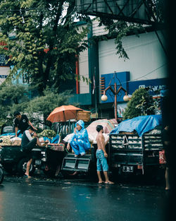 People on wet road in rainy season
