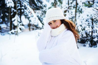 Portrait of young woman in snow