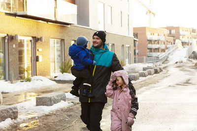 Father walking with children