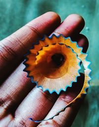 Close-up of hand holding ring