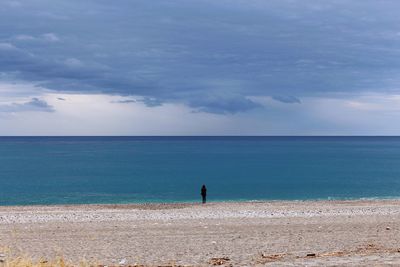 Scenic view of sea against cloudy sky