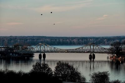 Scenic view of bridge against sky during sunset