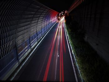 High angle view of light trails on road at night