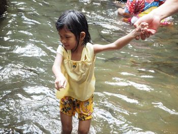 Full length of woman standing in lake