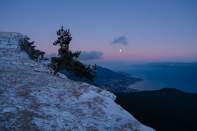 Scenic view of mountains against sky during sunset