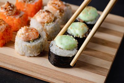 High angle view of sushi on cutting board