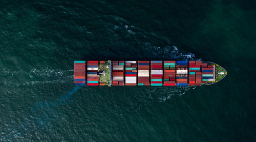 Aerial view container ship in open sea, global business company logistic industry commerce