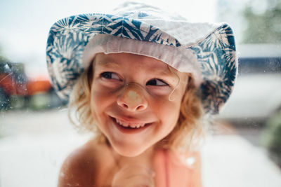 Portrait of smiling girl wearing hat