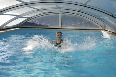 Woman swimming in pool