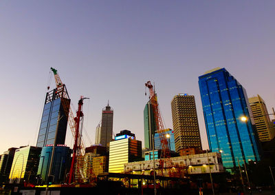 Low angle view of skyscrapers against clear sky