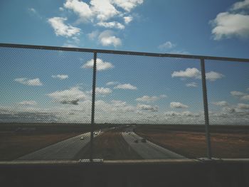 View of road against cloudy sky