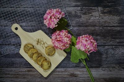 High angle view of pink flower on table