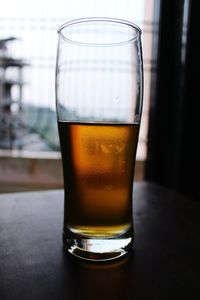 Close-up of beer in glass on table