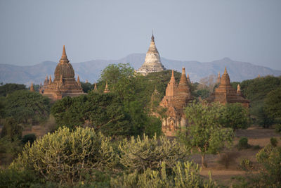 View of temples and mountains against sky