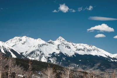 Scenic view of snowcapped mountains against sky