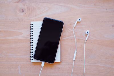 High angle view of smart phone on table