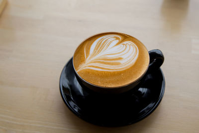 High angle view of cappuccino on table