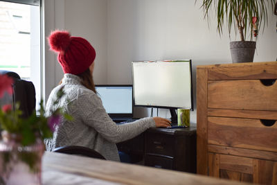 Young woman working from home in winter