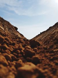 Low angle view of rocks against sky