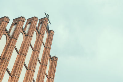 Low angle view of old building against sky