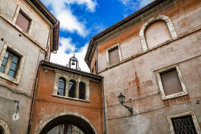 Low angle view of old building against sky