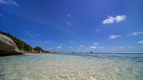 Scenic view of sea against blue sky