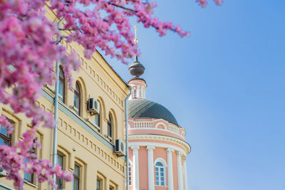 Low angle view of building against blue sky