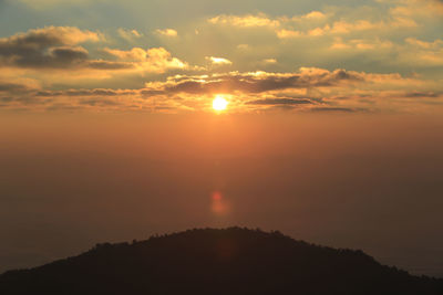 Scenic view of silhouette mountains against sky during sunset